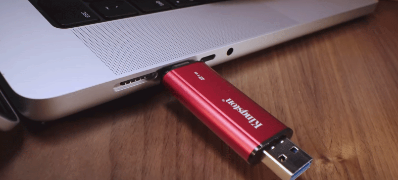 Kingston Dual Portable SSD connected to a laptop for file transfers.