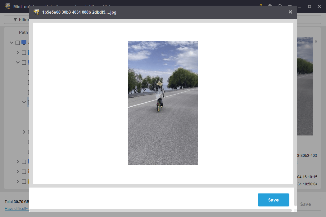 MiniTool Power Data Recovery preview interface displaying a picture of a girl riding a bicycle for file verification.