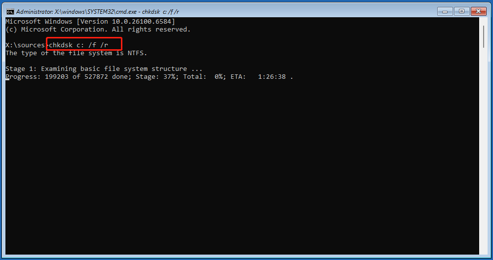 The Command Prompt window in WinRE with the running CHKDSK command.