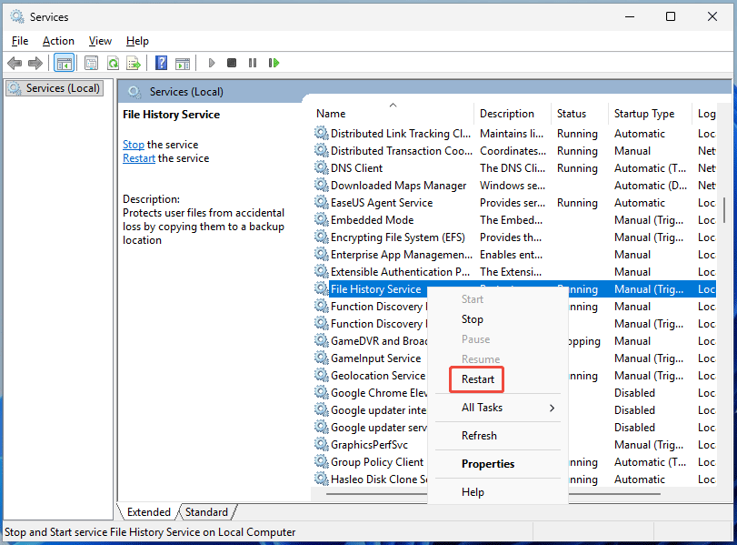 The Services window showing how to restart File History Service.