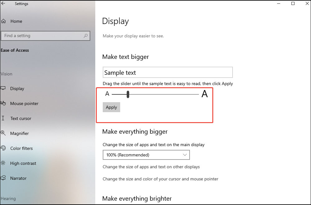 Adjust the slider under Make text bigger to change the font size and click Apply.