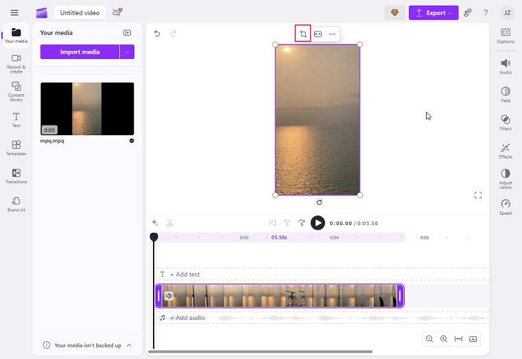 Drag the added video to the timeline and click the Crop icon above the video in Clipchamp