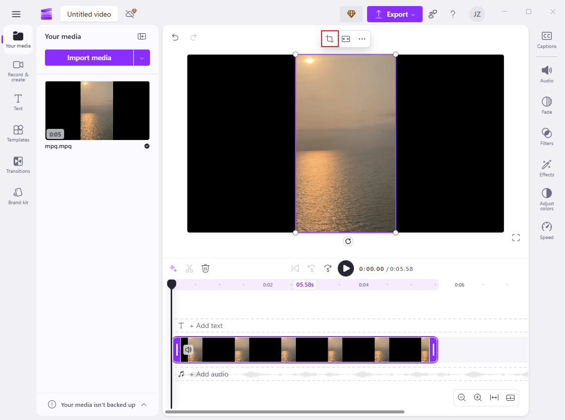 Drag the added video to the timeline and click the Crop icon above the video in Clipchamp