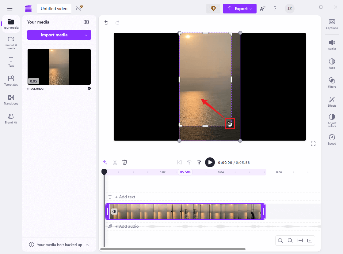 Drag the double-arrow icon inwards to crop the video in Clipchamp