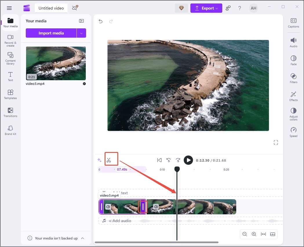Click the Scissors icon to split the video and drag the edge of the clip to trim in Clipchamp