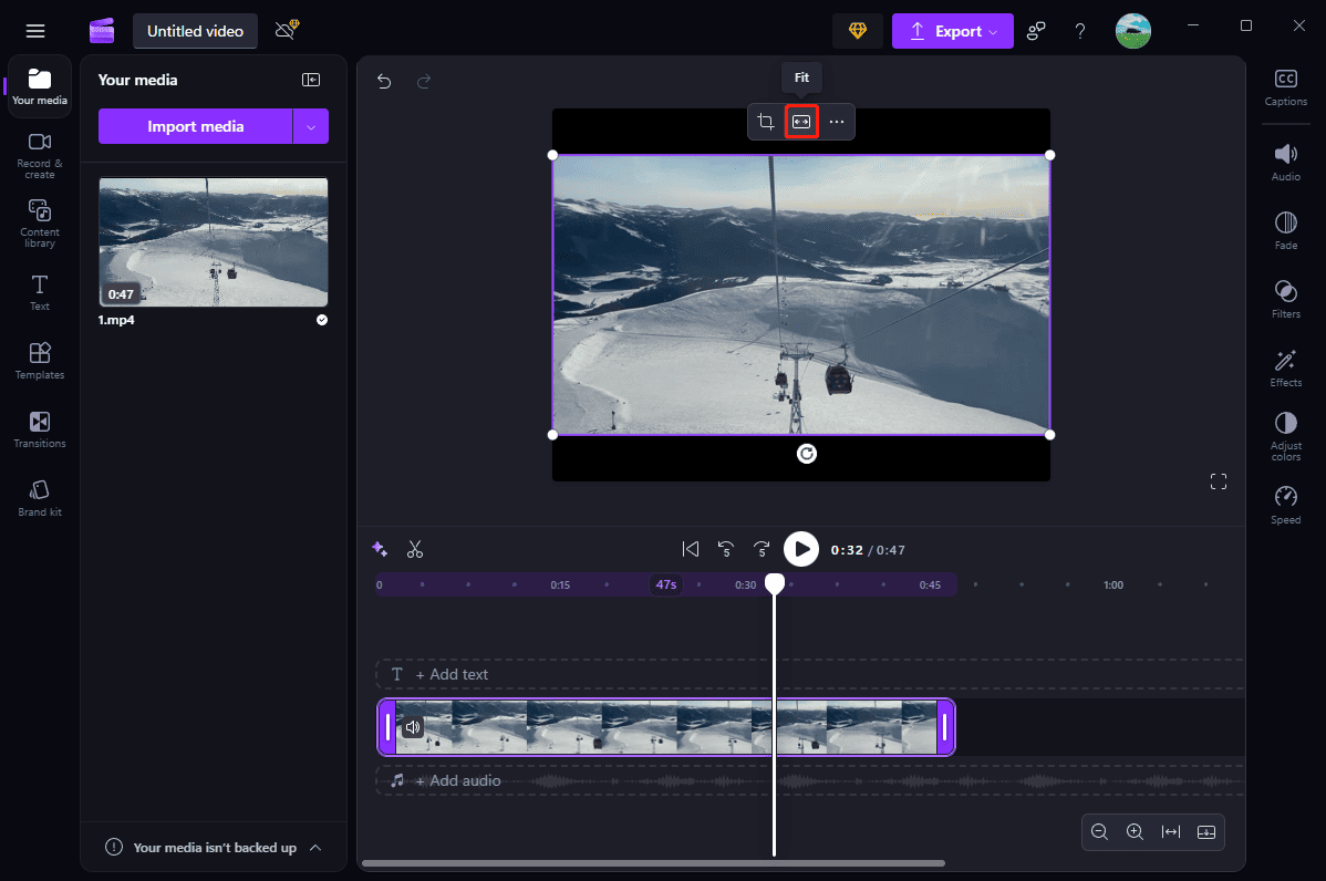 Microsoft Clipchamp player window that shows how to click Fit and Fill to remove black bars.
