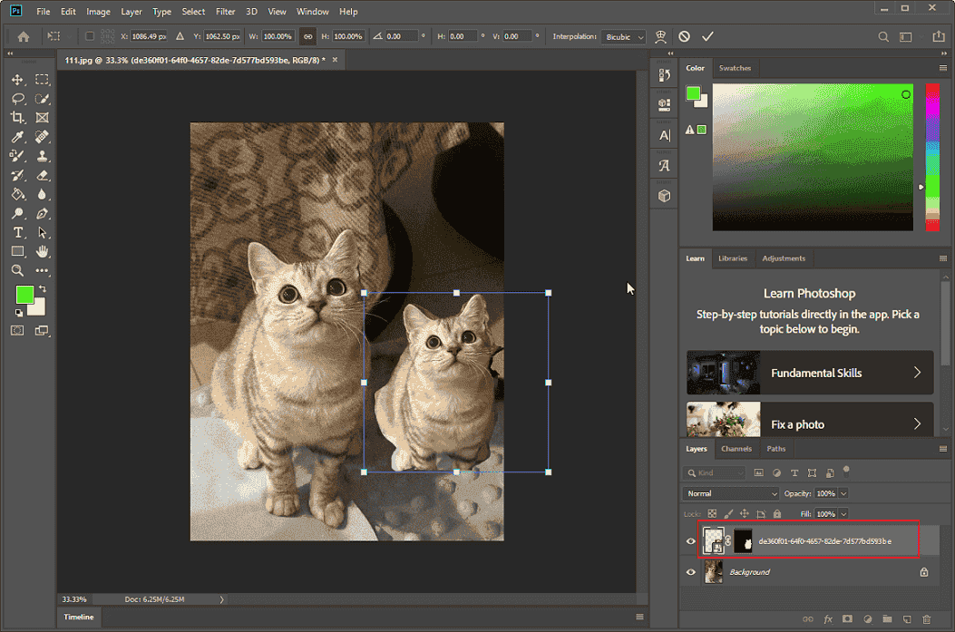 Photoshop’s interface with the cloned layer selected in the Layers section.