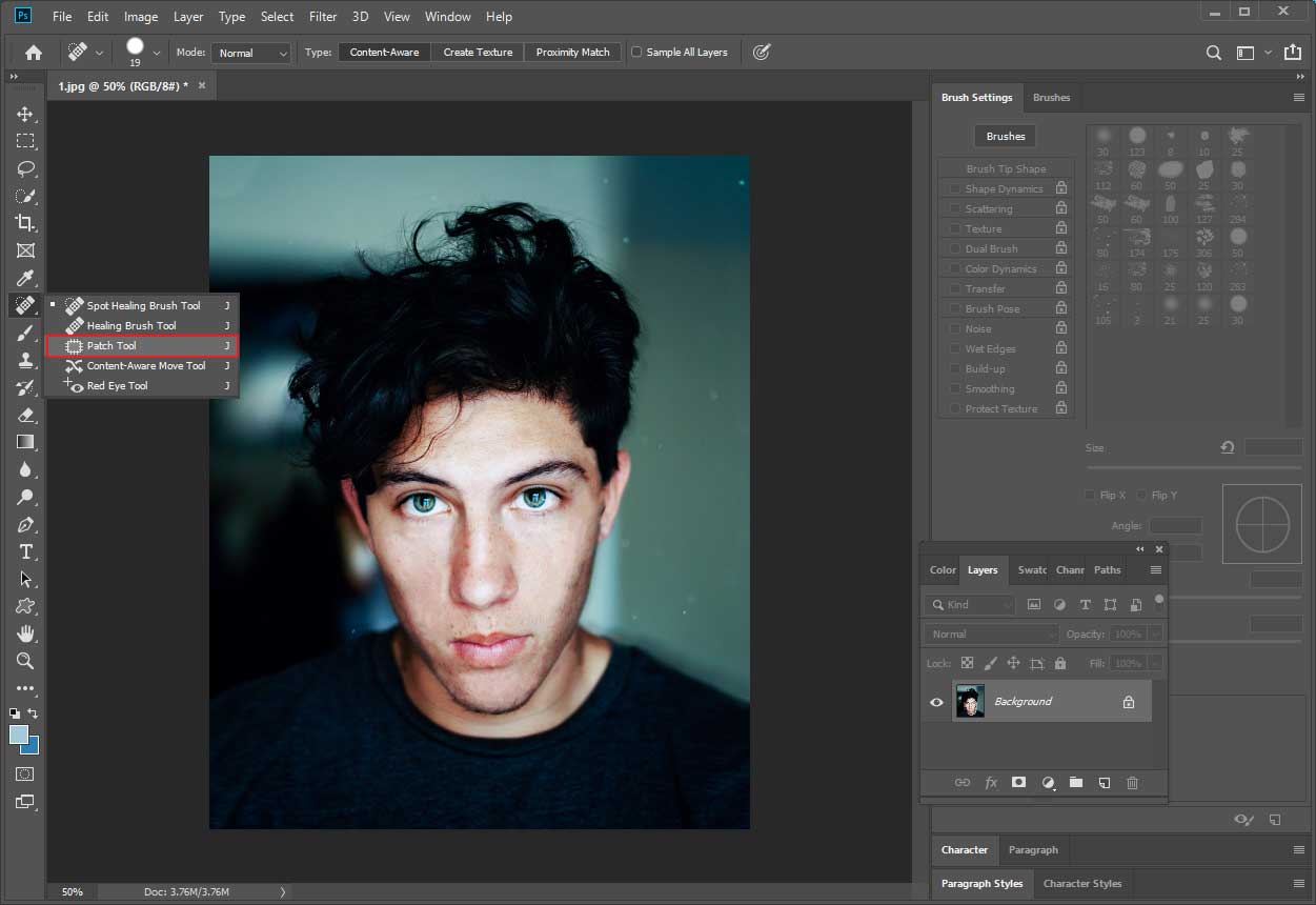Photoshop interface with the selected Patch Tool option in the left toolbar.