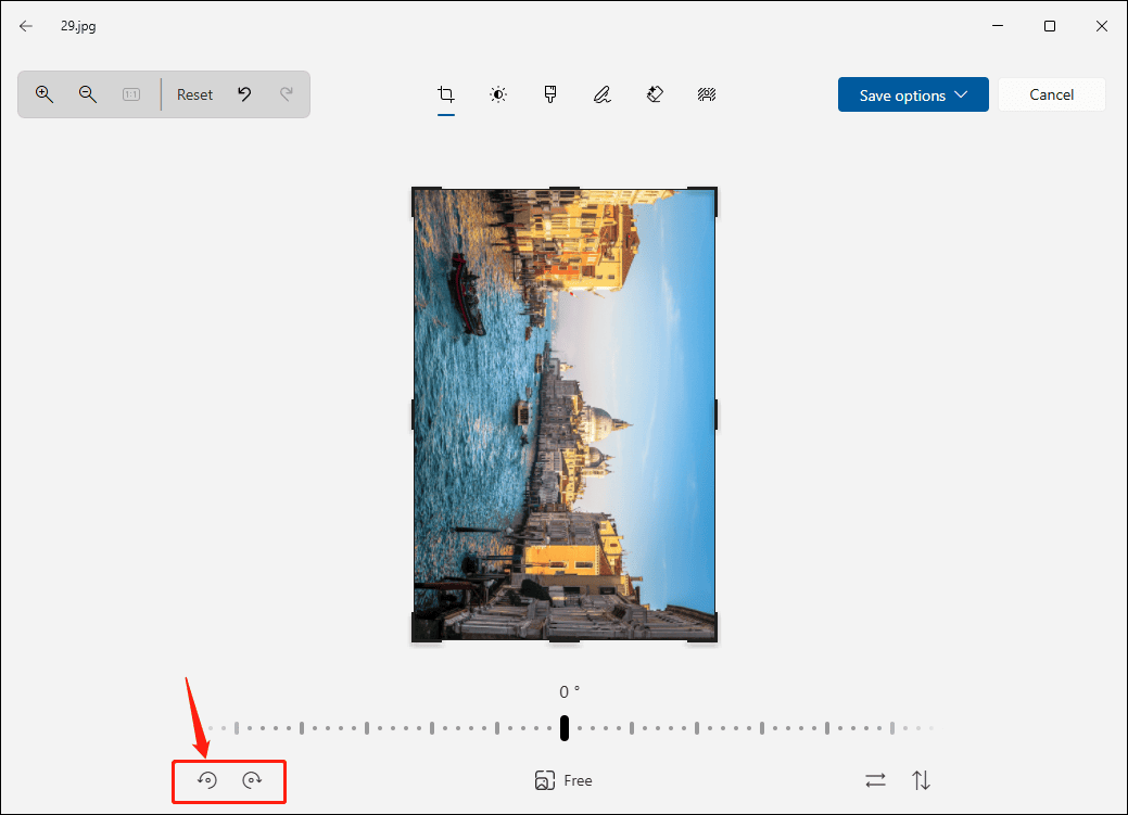 Microsoft Photos editing window with the selected rotate image icons at the bottom.