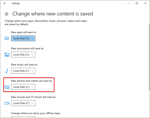 Windows Settings page with the New photos and videos will save to option highlighted