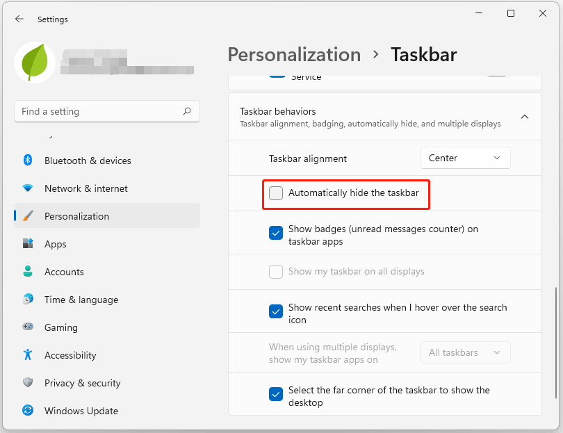 uncheck the Automatically hide the taskbar box