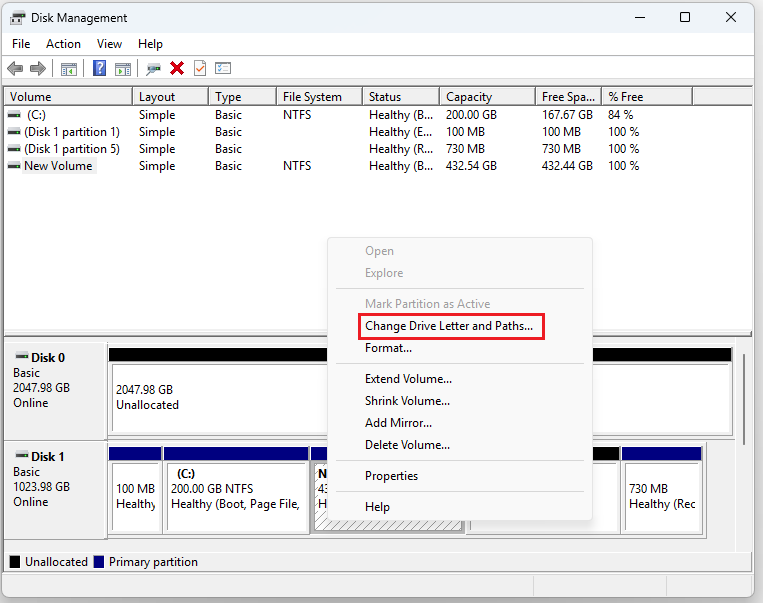 The interface of Disk Management with selected Change Drive Letter and Paths.
