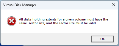The error message stating all disks holding extents for a given volume must have the same sector size, and the sector size must be valid.