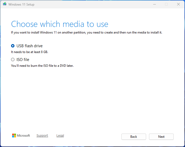 The Windows 11 Setup interface showing the USB flash drive and ISO file media options.