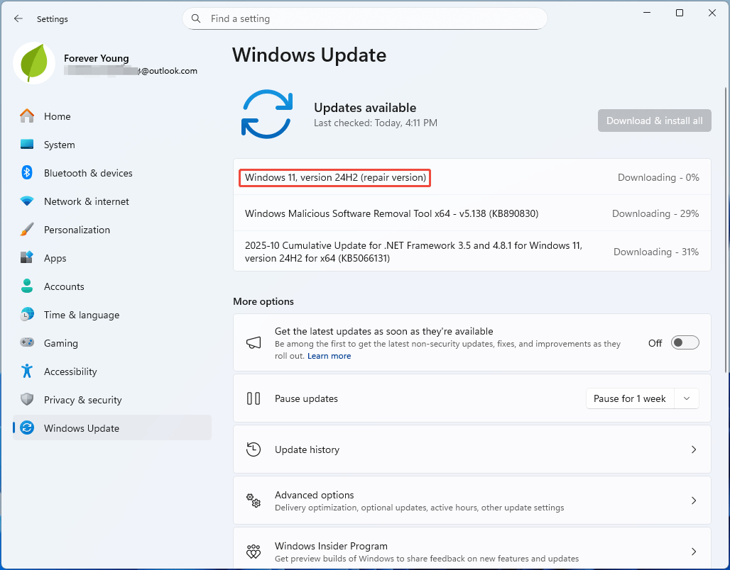 The Windows Update page in Windows 11 Settings with the repair Windows version being downloaded.