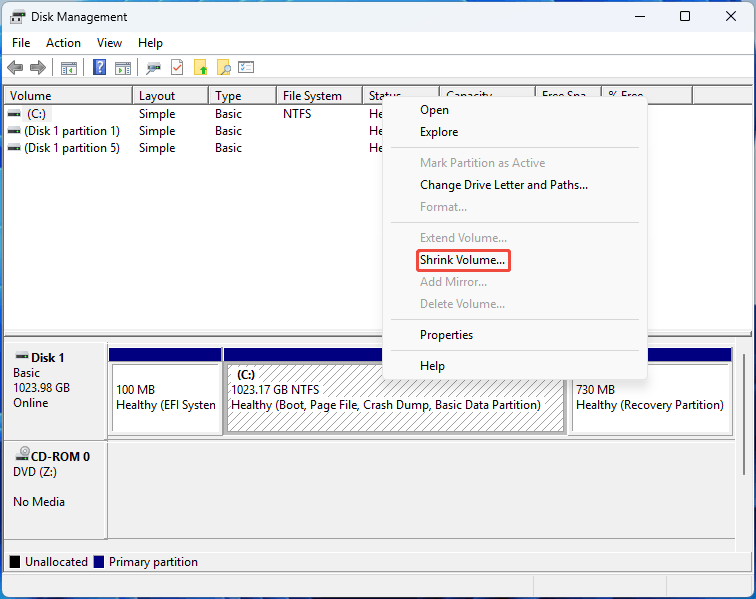 Disk Management interface with the selected Shrink Volume option.