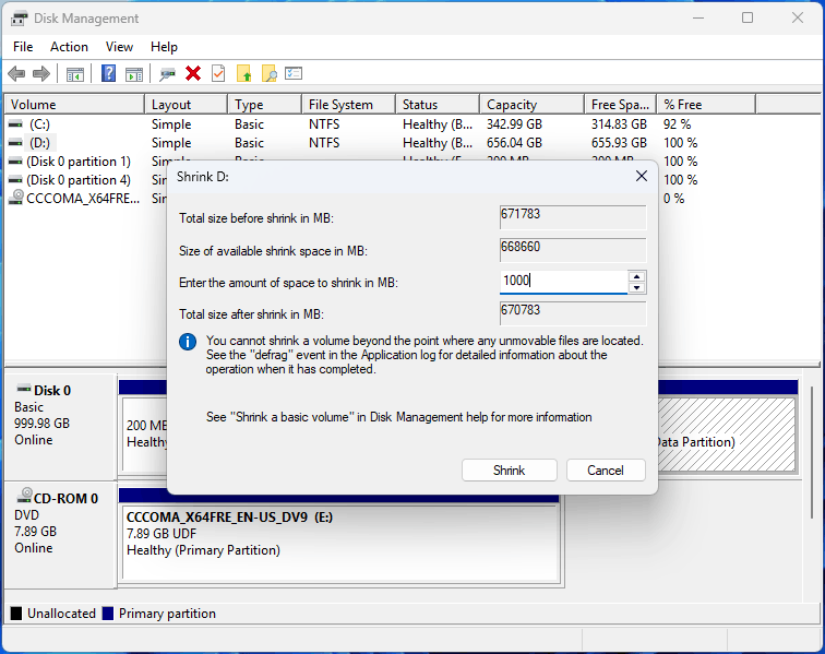 Disk Management interface with the Shrink D window.