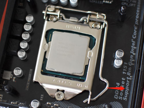pull away the metal arm next to the CPU socket