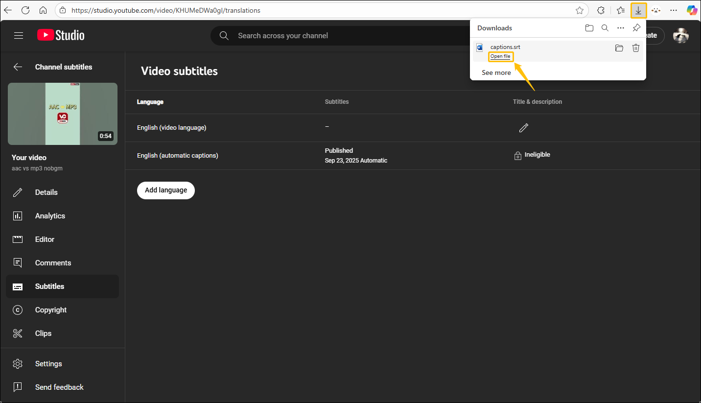 YouTube Studio’s Video subtitles page with browser’s Downloads prompt showing at the top-right