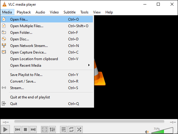 VLC media player interface with the Media menu opened and the Open File option highlighted.