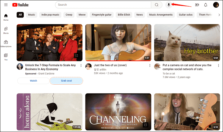 Click on the microphone icon to search with your voice on YouTube