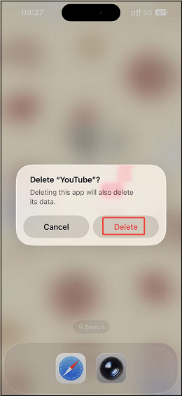 The iPhone homepage with the Delete option selected in the Delete YouTube popup.